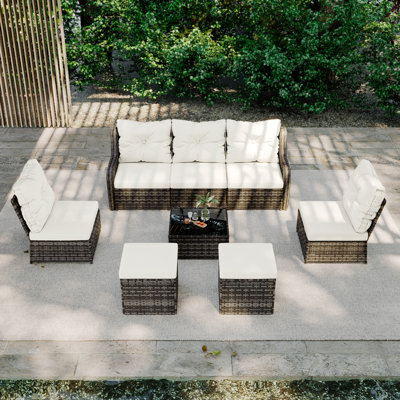 Ensemble de conversation d'extérieur en osier pour cinq personnes avec table basse et deux repose-pieds Louann