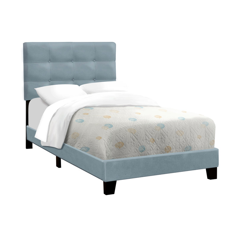 Lit plateforme tapissier bleu en velours pour une chambre chic