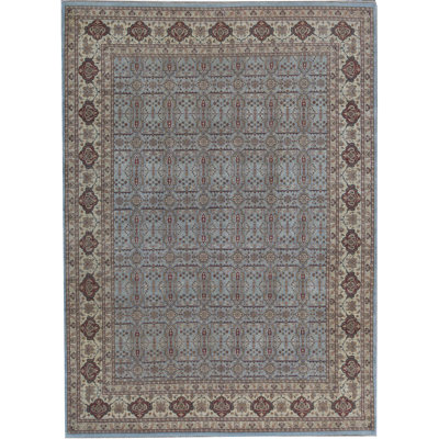 Tapis bleu et ivoire de haute qualité noué à la main