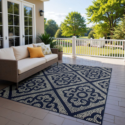 Tapis intérieur / extérieur bleu marine / ivoire Anastasaos