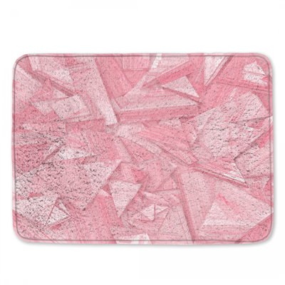 Tapis de bain rose à triangles géométriques