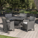 Ledezma 4 - Person Wicker Patio Dining Set with Square Table , Cushions Included