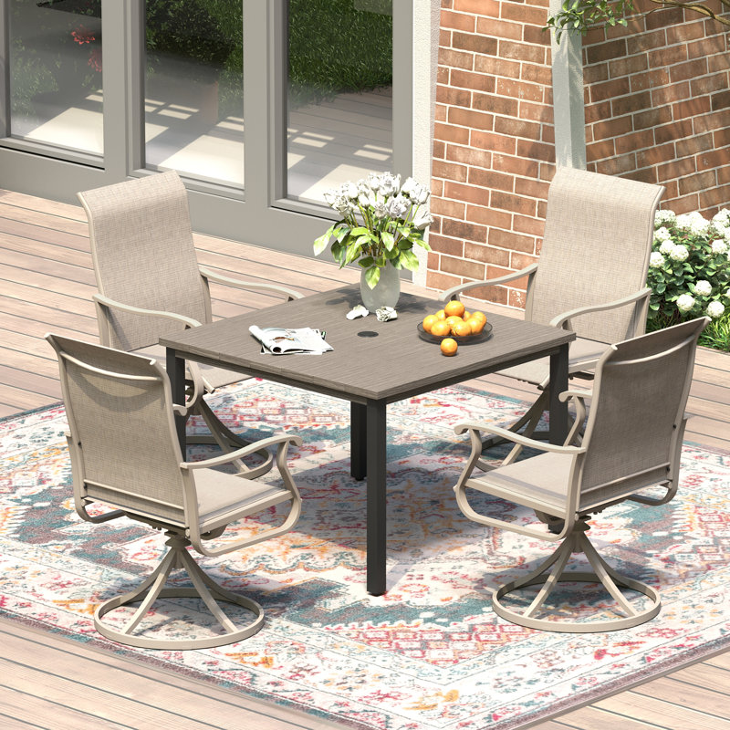 Ensemble repas pour 4 personnes avec table carrée en métal et chaises pivotantes PVC-coated polyester
