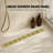 Majesta 32" Brushed Gold linear grid drain-126309749