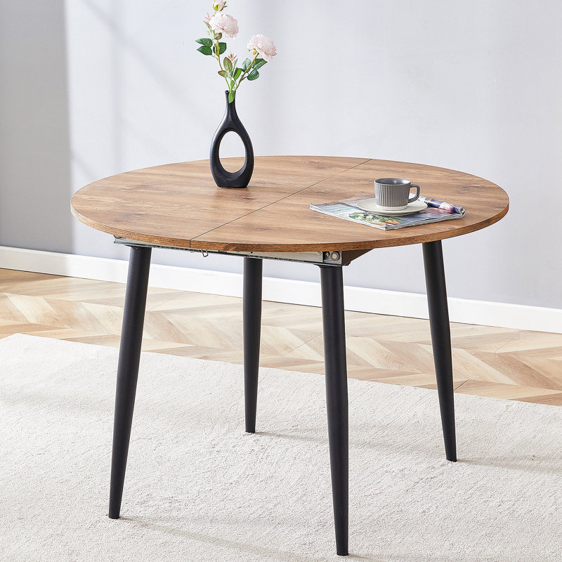 Avec un mécanisme rétractable astucieux, le plateau de table en bois aggloméré et les pieds en métal noir ont une surface lisse et délicate. Le look unique crée la silhouette élégante d'une maison moderne.