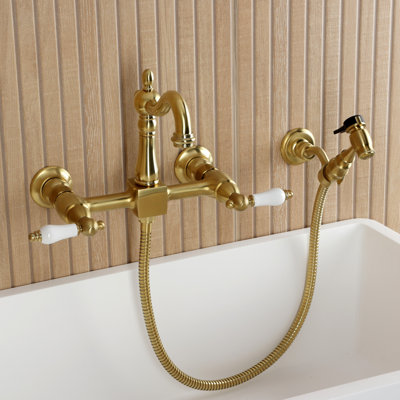 Kingston Brass Heritage Double-Handle 3-Hole Wall-Mount Bridge Kitchen Faucet With Brass Sprayer