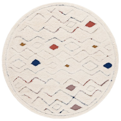 Doneshia Hand Tufted Wool/Cotton Southwestern Rug in Ivory/Rust