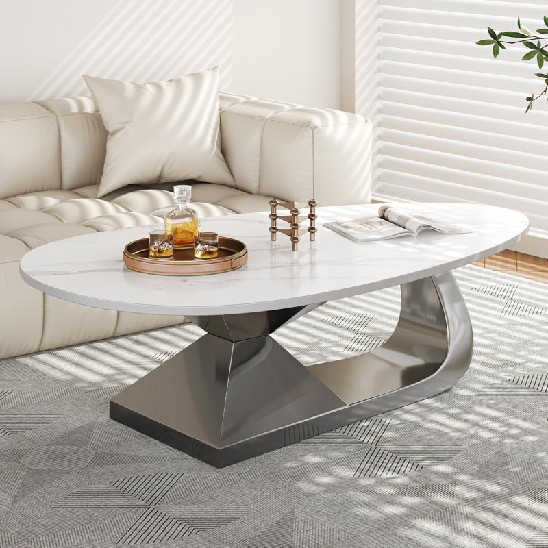 Table basse moderne en pierre frittée avec base en acier inoxydable