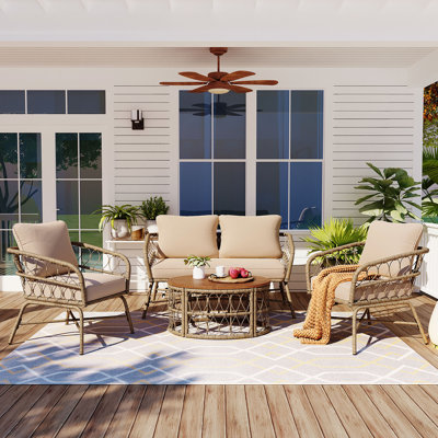 Noralf Acacia Wicker 4 - Person Patio Conversation Set with Cushions