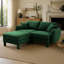 Canapé d'angle 2 places en tissu bouclé, avec accoudoirs originaux en forme de coquillage et pouf amovible, pieds cylindriques recouverts du même tissu, coloris vert.