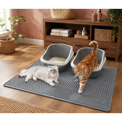 Extra-large 47 x 35 in silicone litter mat with waterproof protection for scatter control; the surface is soft on kitty paws, non-slip, and easy to clean.