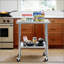 Table en acier inoxydable durable avec roulettes pour la préparation et le travail, idéale pour les cuisines et les garages commerciaux