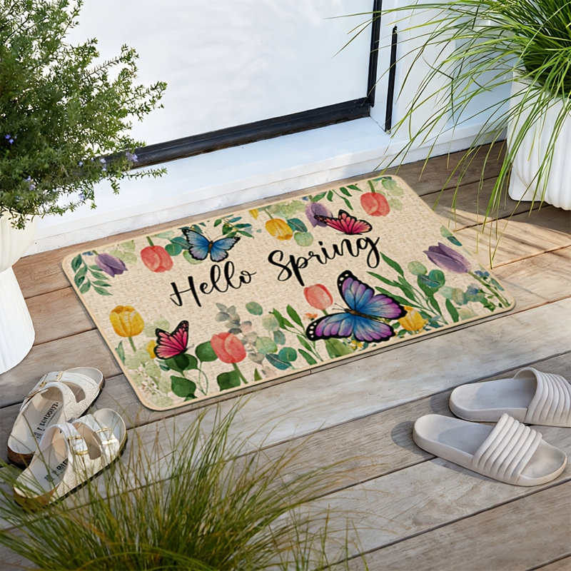 Tapis de porte « Bonjour Printemps » à motifs de papillons et de tulipes, décoratif pour l'extérieur, antidérapant, avec dos en caoutchouc. Parfait pour l'entrée, l'intérieur et la cuisine. 43 x 74 cm (17 x 29 pouces).