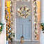 Couronne de Noël pré-éclairée 24 po avec flocon de neige et décoration de pomme de pin, lumières DEL à pile pour la porte d'entrée