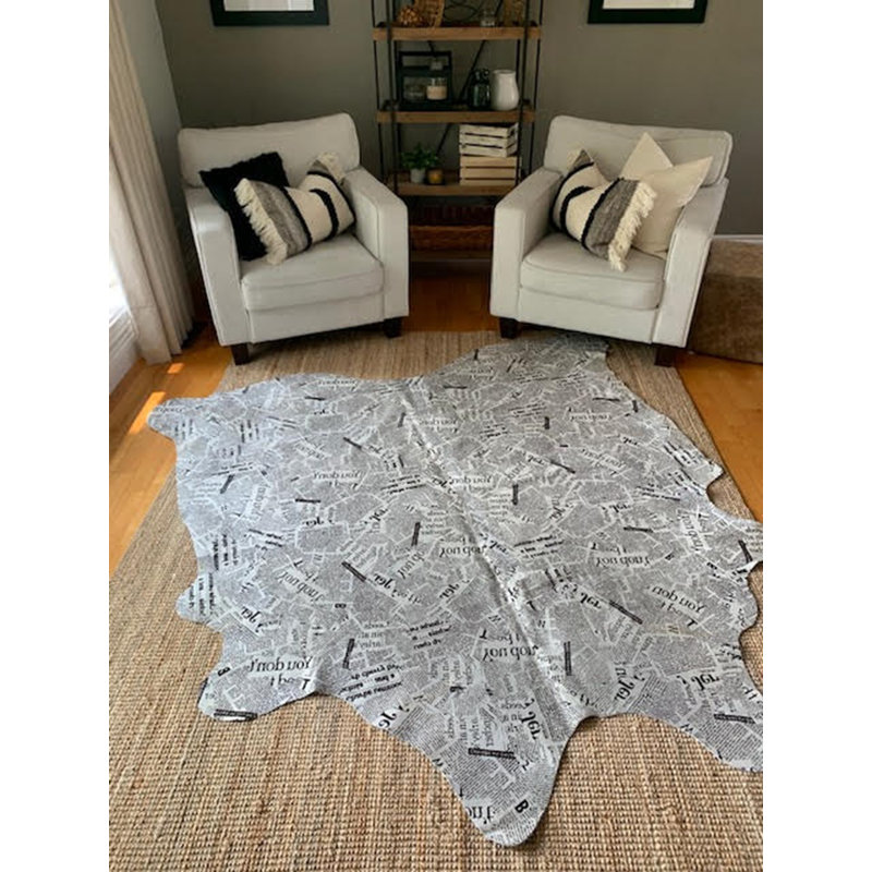 Newspaper Print Cowhide Rug