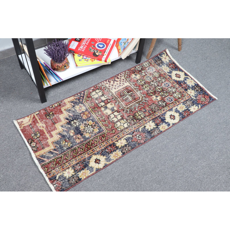 Handmade Vintage Turkish Area Rug With Rich Red and Blue Floral Design Featuring Unique Geometric Patterns Ideal for Any Space