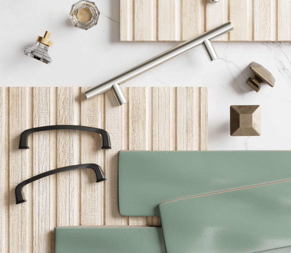 An assortment of cabinet hardware and material samples.