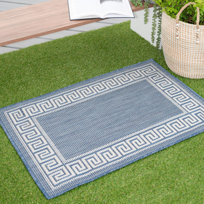 Tapis d'intérieur / extérieur bleu tissé à plat Drusilla