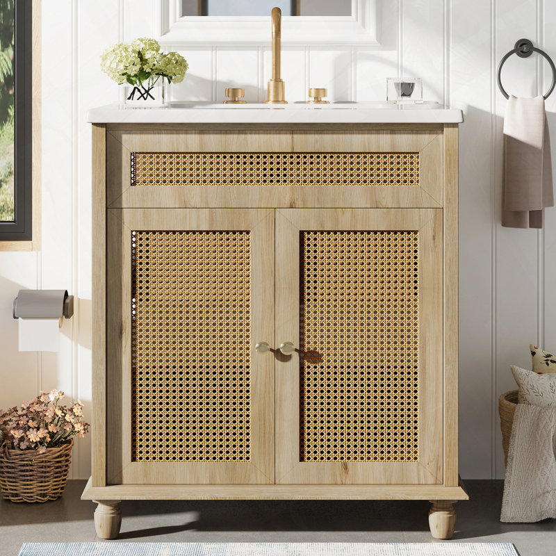 Meuble-lavabo avec portes en rotin tissé à la main, pieds en bois massif et bassin en résine