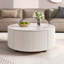 Table basse élégante à conception ronde avec roulettes, parfaite pour les petits espaces
