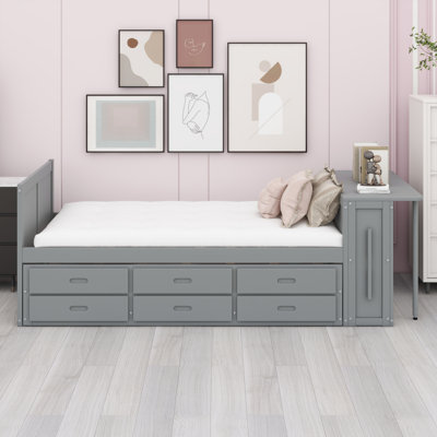 Lit plateforme multifonctionnel en bois avec bureau, tablette de rangement au bout du lit, lit gigogne intégré et tiroirs