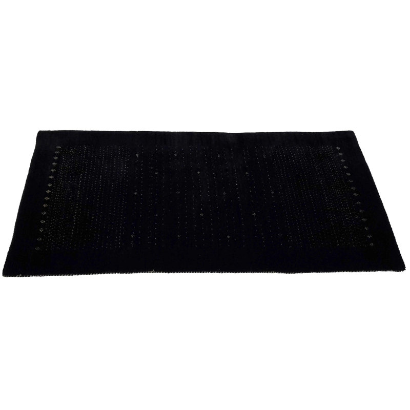 Ovide Polka Dots Area Rug in Black