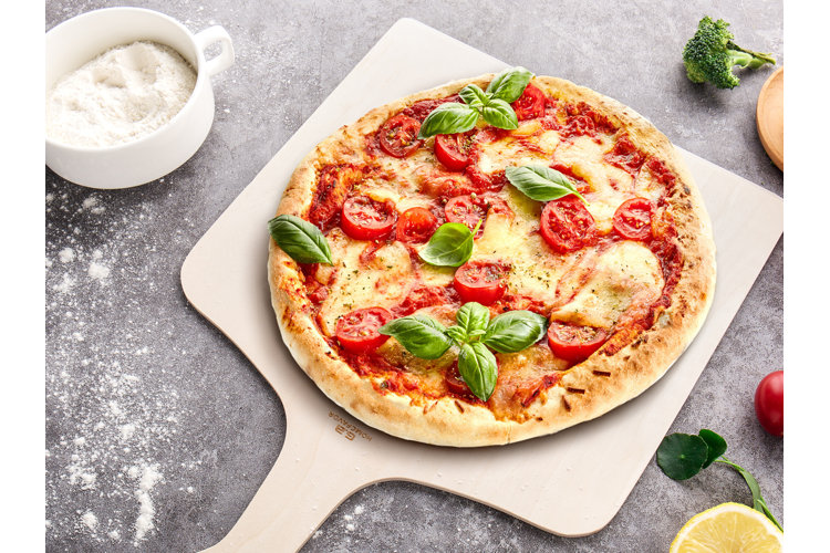 What Is a Pizza Peel? Definition, Uses, Origins, & More
