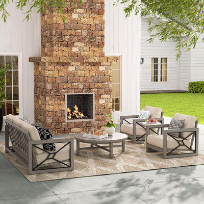 Ensemble de conversation de patio en aluminium pour 5 personnes avec table basse ronde et coussins Sunbrella® Marindo