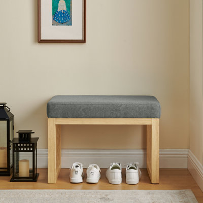 Banc à langer gris foncé, contours épurés, structure en bois massif, coussin moelleux, facile à assembler dans les petites pièces, idéal pour les grandes surfaces
