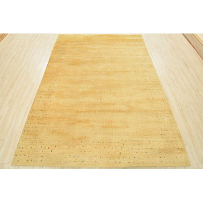 Tapis oriental doré en laine noué à la main