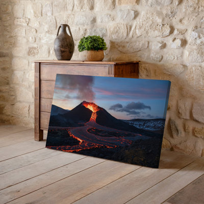 Canvas A Dramatic Volcanic Landscape At Dusk Featuring A Towering Volcano Wall Art With A Fiery Lava Flow Cascading Down Its Slopes Canvas Wall Art