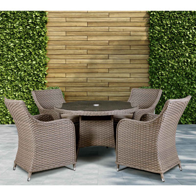 Cynthis 4 - Person Wicker Patio Dining Set with Round Table , Cushions Included