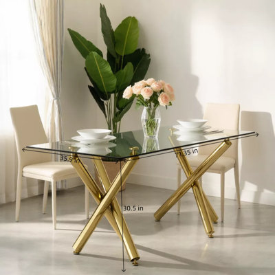 Table de salle à manger moderne et minimaliste rectangulaire en verre trempé avec pieds en métal doré pouvant accueillir six à huit personnes
