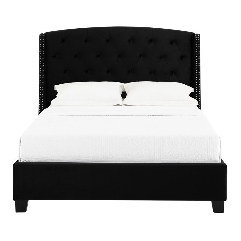Lit tapissier chic avec capitonnage à boutons, garniture cloutée et capitonnage noir élégant