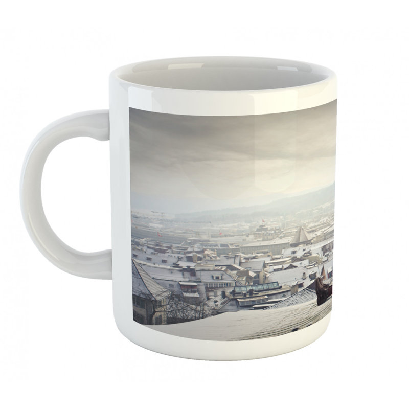 Tasse à café père noël assis sur un toit