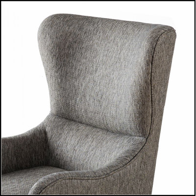 Fauteuil à oreilles confortable avec des matériaux de haute qualité pour une détente et une élégance ultimes, parfait pour tout espace de vie.