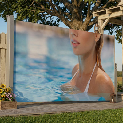 Adjustable side awning blind, measuring 71 x 138 inches; semi-transparent with UV print treatment; certified UPF 50+; excellently suited for obstructing dirt, sunlight, and gusts; carves out an intimate space fitting for gardens, patios, and pool areas.