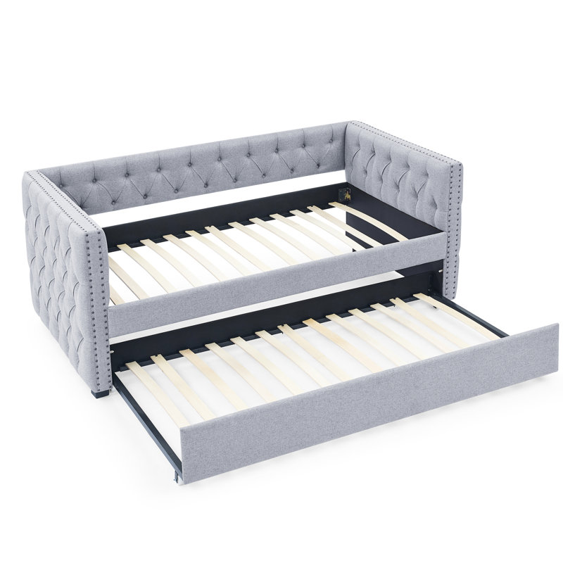 Lit de jour simple avec lit gigogne, lin gris confortable, bouton, revêtement en bois d'eucalyptus, accoudoirs carrés en cuivre, conception ergonomique