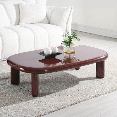 Table basse en MDF, base en métal rouge ultrabrillant