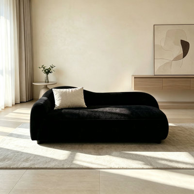 Minimalist black fabric chaise lounge