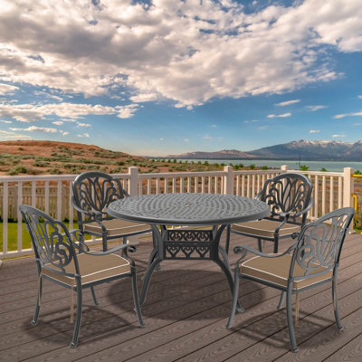 Set Of Cast Aluminum Patio Furniture With Black Frame And Brown Seat Cushions