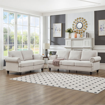 Canapé rembourré en polyester de style moderne et classique avec clous pour salon 2 + 3 places.