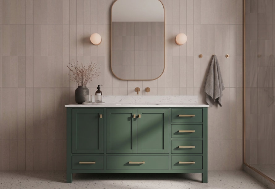 Green double bathroom vanity with brass hardware, marble countertop, and rounded rectangular mirror against a light-toned vertical tile wall.