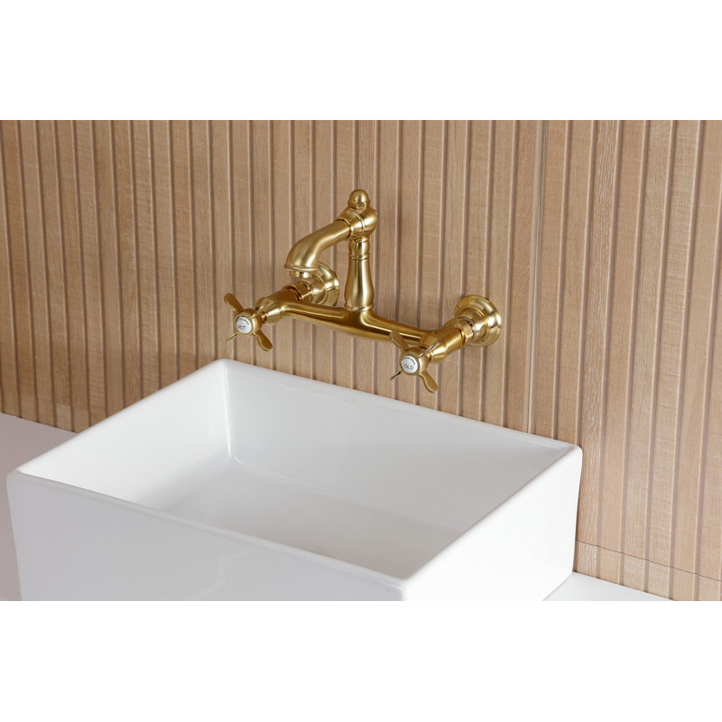 Kingston Brass Essex Two-Handle 2-Hole Wall Mount Bathroom Faucet, Brushed Brass