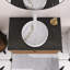 Meuble-lavabo mural 30 po couleur de grain de bois espresso, comptoir noir et lavabo rond en céramique blanche avec motif de pierre.