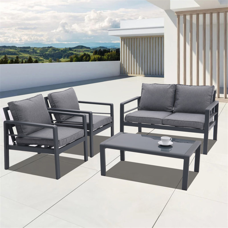 Ensemble de patio extérieur 4 pièces toutes saisons avec coussins confortables et table basse robuste pour divers espaces
