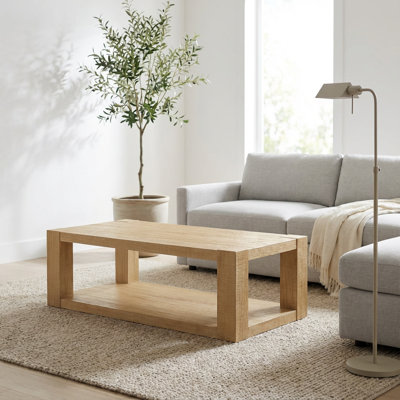 Table basse contemporaine à deux niveaux avec tablette ouverte