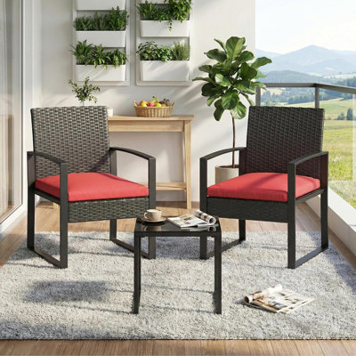 Ensemble de bar élégant en PE en rotin noir, mobilier d'extérieur résistant aux intempéries, table en verre trempé, coussins rouges