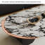 Table basse ronde en marbre clair-107197747