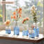 Ensemble de 12 petits vases à fleurs en verre-98408728